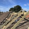 Professional roofers installing a new roof on a house in Bristol.